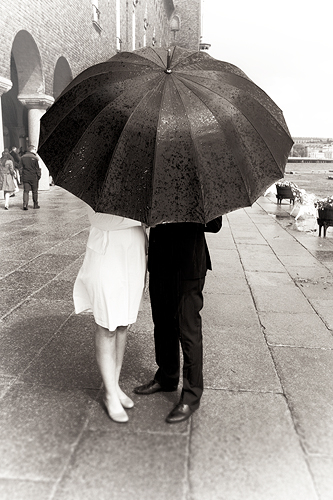 hiding behind the umbrella