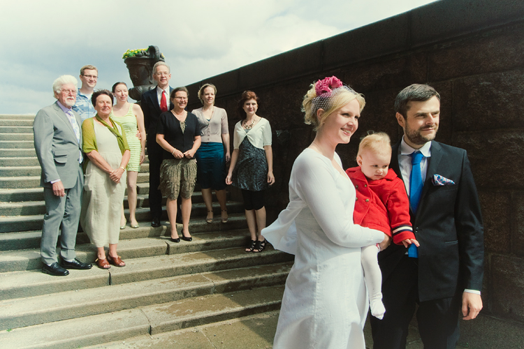 the family gathers on the stairs, side view. bit windy